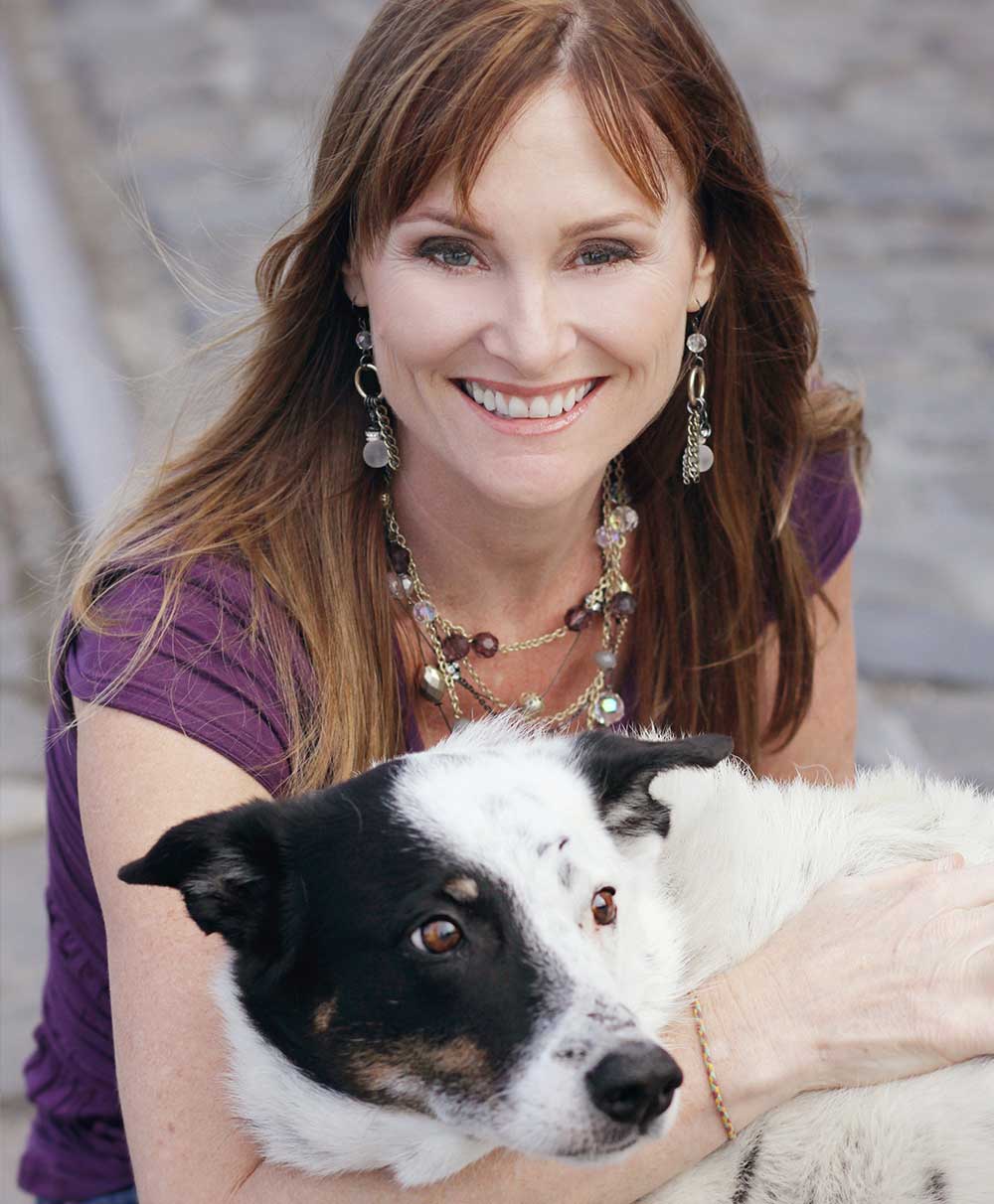 Kristin-Morrison-Business-Coach- Kristin Morrison with black and white dog